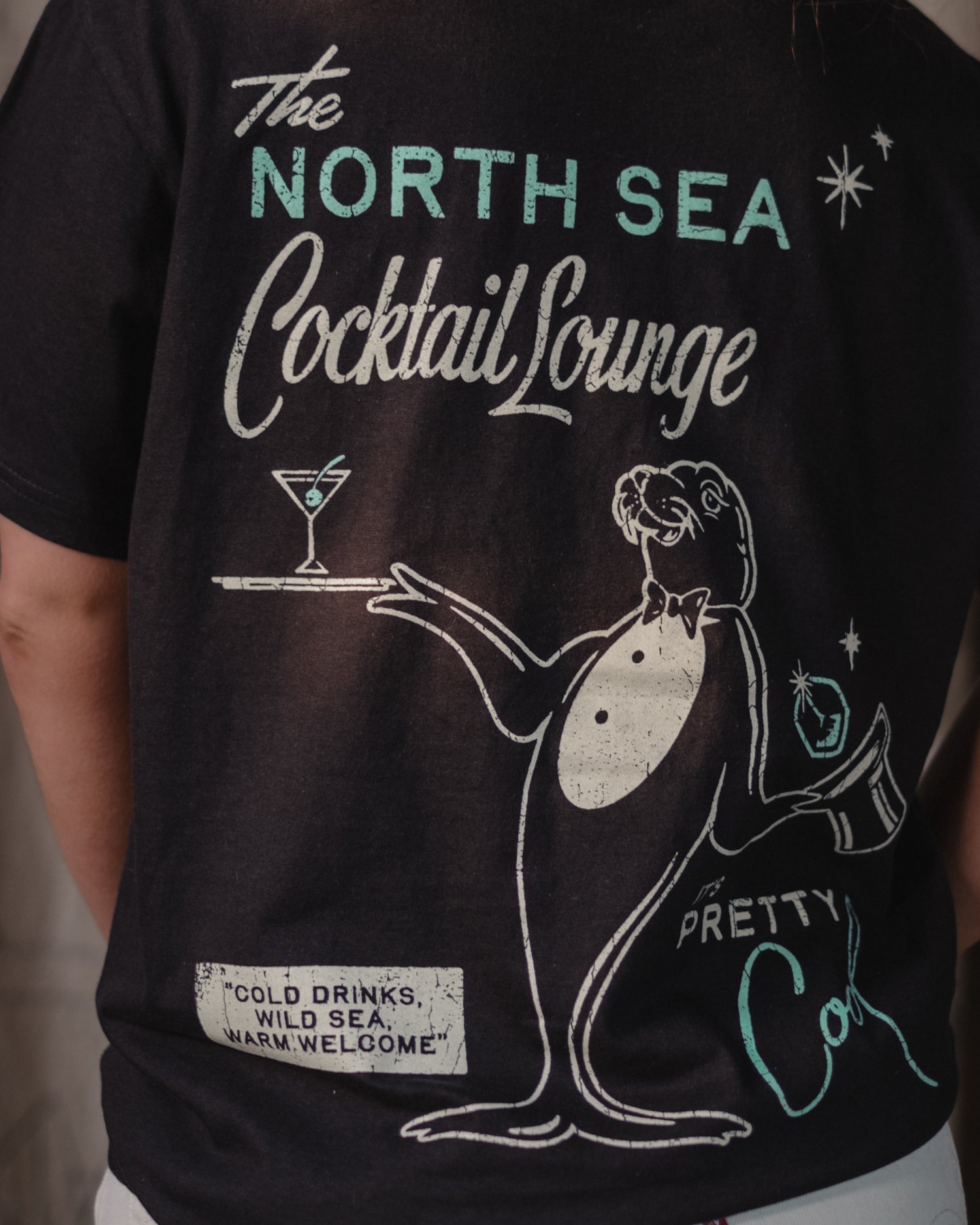 The North Sea Cocktail Lounge T-Shirt by Art Disco