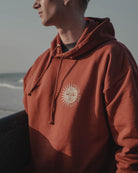 Terracotta hoody with sun and moon design by Art Disco Original Goods
