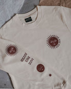 Cream 'Enjoy the Now' sweatshirt by ART DISCO Original Goods with sleeve print