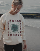 Inhale Exhale cream sweatshirt with sun moon and stars design by Art Disco Original Goods