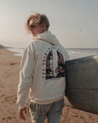 Surfing Siren cream hoody with long boarding mermaid on the back by ART DISCO Original Goods