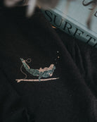 Wild Dreamer black sweatshirt with surfer by ART DISCO Original Goods