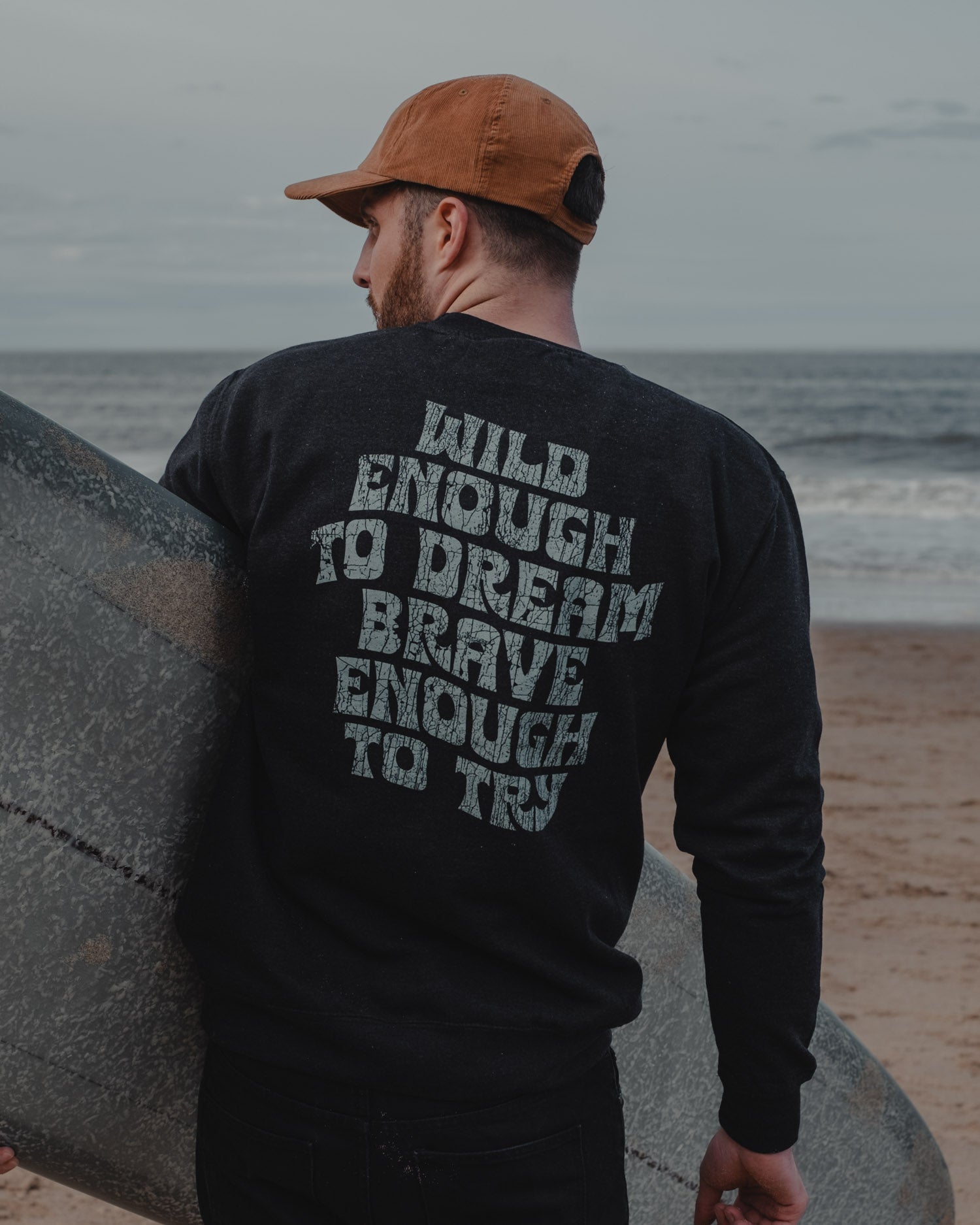 Wild Dreamer Black Sweatshirt with surfer on front by ART DISCO Original Goods
